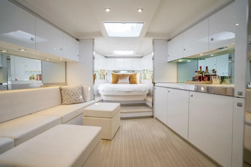 L.o.u. Yacht Photos Pics Luxurious interior of 2016 VanDutch 55 yacht with modern white furnishings and elegant decor.