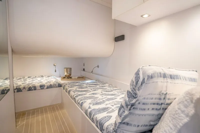 L.o.u. Yacht Photos Pics Interior cabin of 2016 VanDutch 55 yacht with cozy bedding and modern lighting.