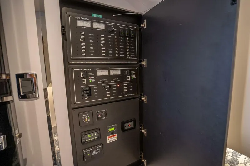 L.o.u. Yacht Photos Pics Electrical control panel inside a 2016 VanDutch 55 yacht, featuring AC and DC systems.
