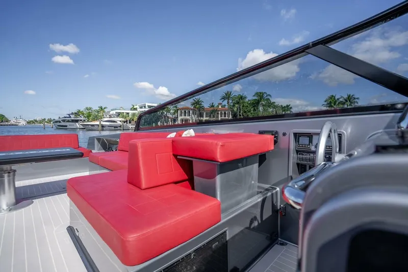 L.o.u. Yacht Photos Pics Luxurious 2016 VanDutch 55 yacht with red seating, sleek design, and waterfront view.