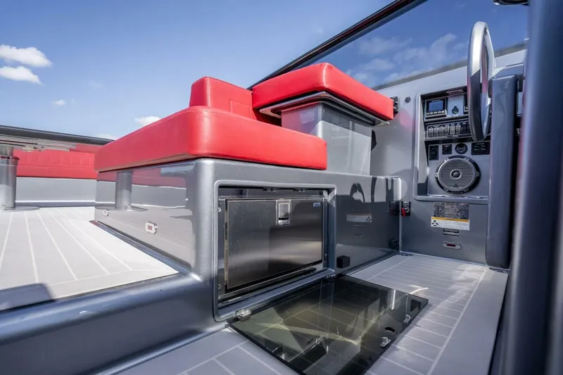 L.o.u. Yacht Photos Pics Interior of 2016 VanDutch 55 yacht with red seating and modern controls.