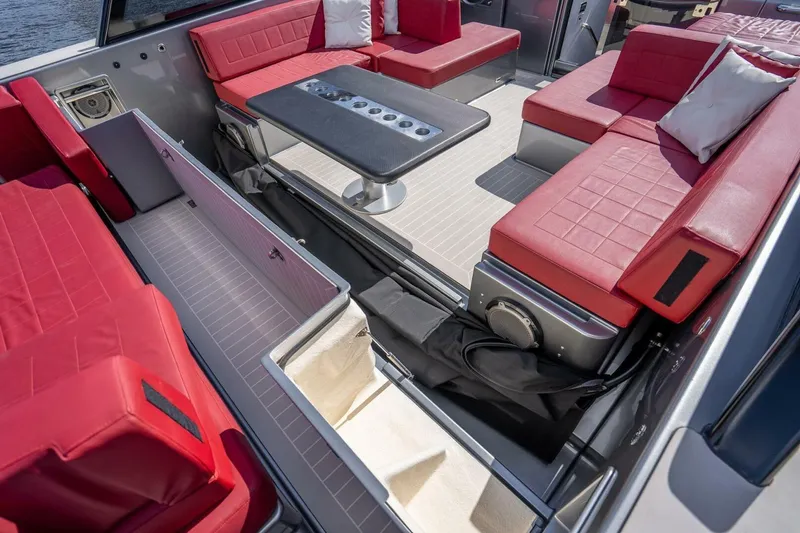 L.o.u. Yacht Photos Pics Luxurious 2016 VanDutch 55 yacht interior with red seating and storage compartments.