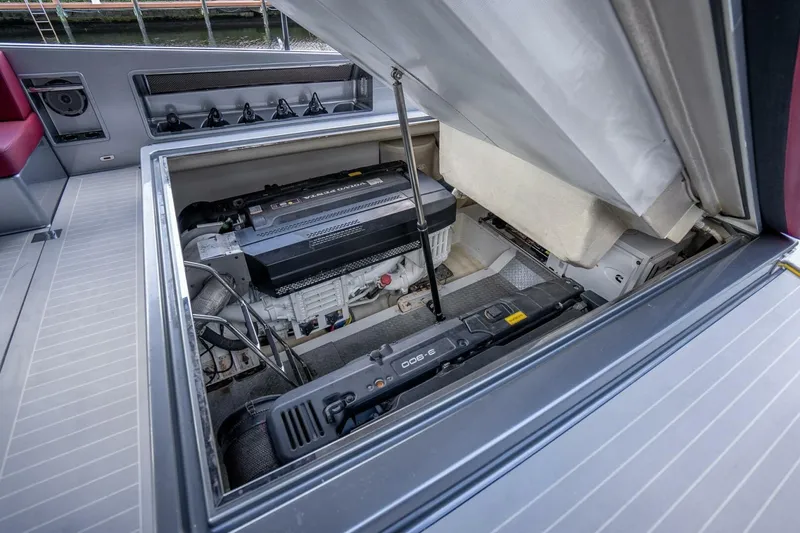 L.o.u. Yacht Photos Pics Engine compartment of a 2016 VanDutch 55 yacht, showcasing mechanical components and storage.