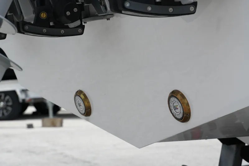  Yacht Photos Pics 2025 Fountain 38 CC boat hull with brass fittings, close-up view.