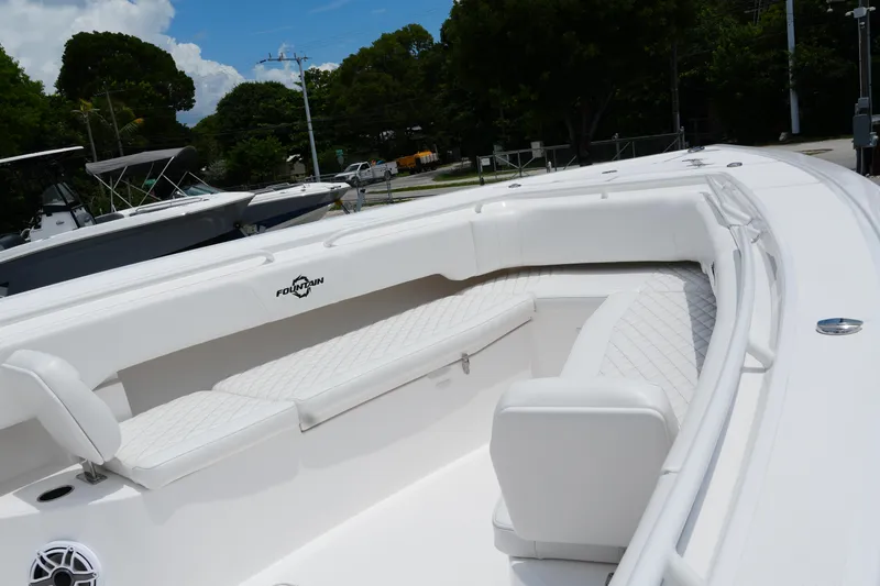  Yacht Photos Pics 2025 Fountain 38 CC boat with white seating and sleek design.