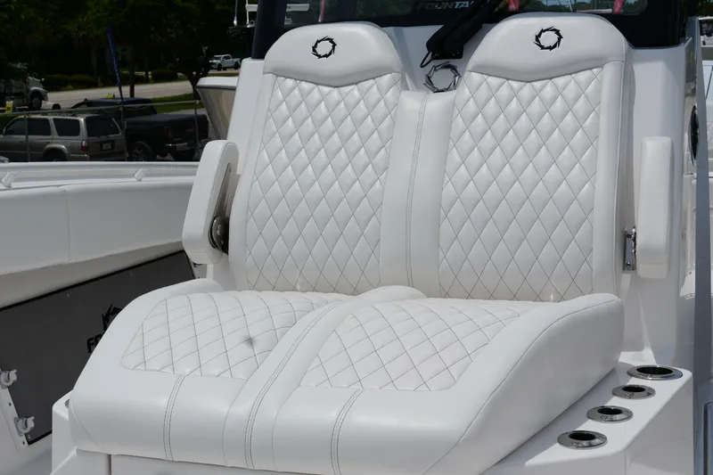  Yacht Photos Pics Luxurious white leather seats on 2025 Fountain 38 CC boat, featuring diamond stitching.