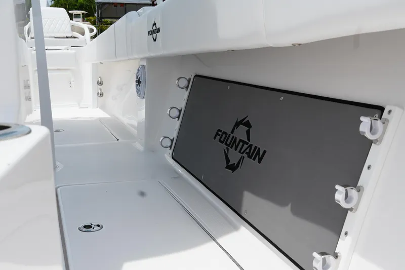  Yacht Photos Pics 2025 Fountain 38 CC boat interior with sleek white design and branded panel.