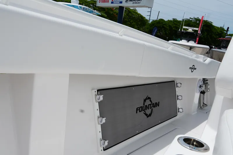 Yacht Photos Pics 2025 Fountain 38 CC boat interior with branded panel and cup holder.