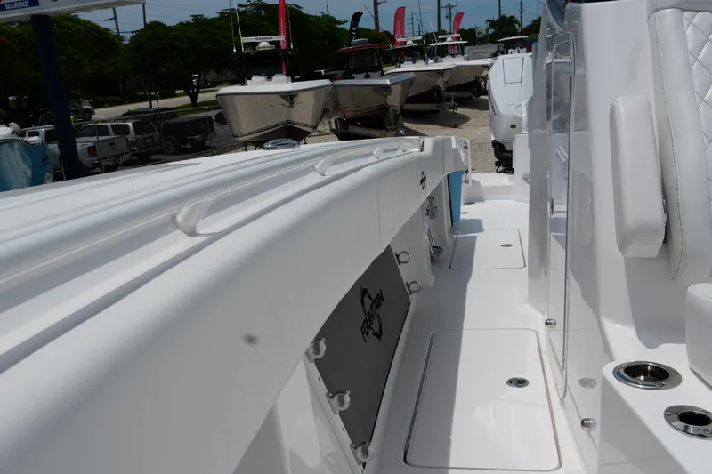  Yacht Photos Pics 2025 Fountain 38 CC boat interior with white seating and storage compartments.