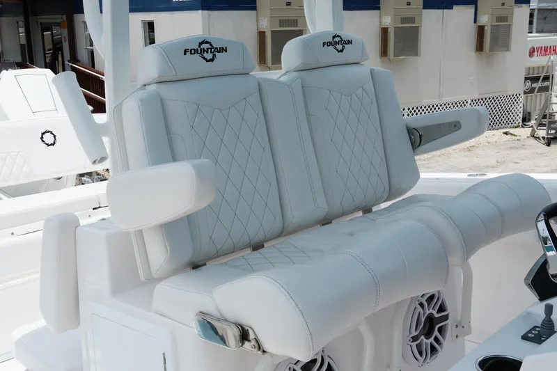  Yacht Photos Pics 2025 Fountain 38 CC boat with luxurious white seating and armrests.