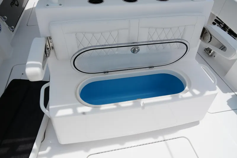  Yacht Photos Pics 2025 Fountain 38 CC boat interior with open storage compartment.