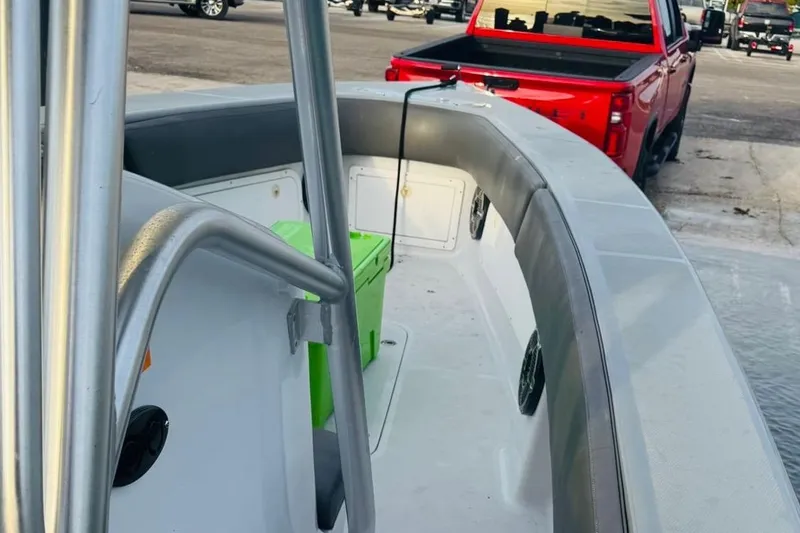  Yacht Photos Pics 2005 Carrera Boats 32 interior with green cooler, docked near red truck.