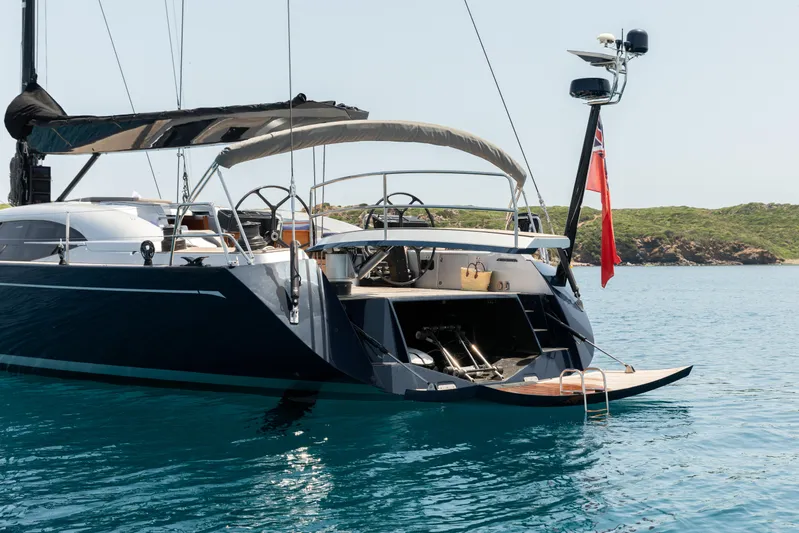 Caiarossa Yacht Photos Pics Luxurious 2009 Shipman 72 yacht anchored in serene blue waters.