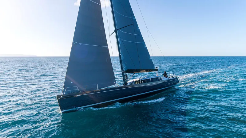 Caiarossa Yacht Photos Pics Sailing yacht Shipman 72 (2009) gliding on open sea under clear blue sky.