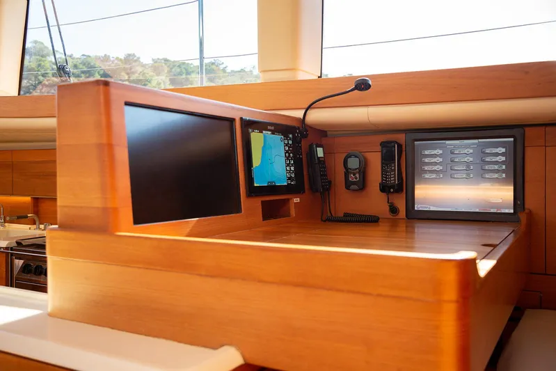 Caiarossa Yacht Photos Pics Navigation station on 2009 Shipman 72 yacht with screens and communication devices.