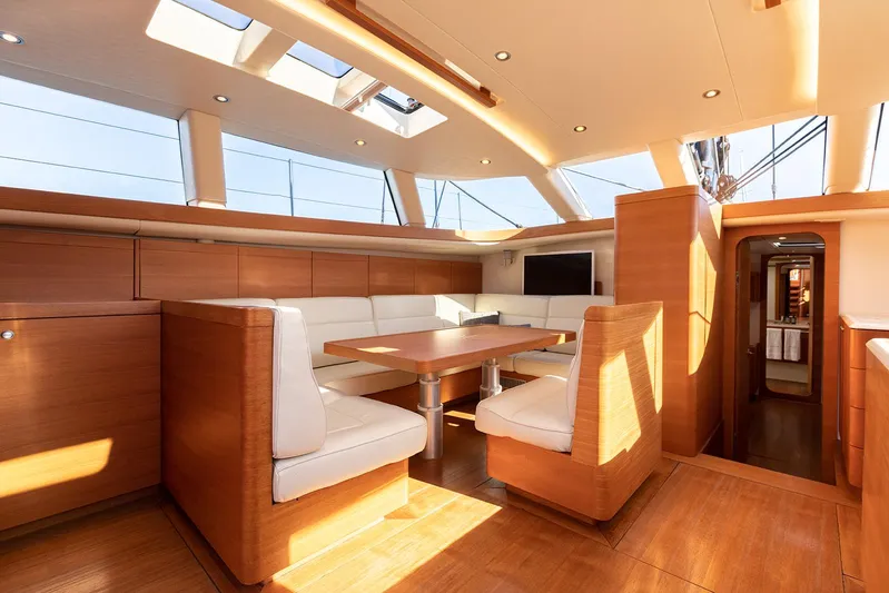 Caiarossa Yacht Photos Pics Luxurious interior of 2009 Shipman 72 yacht with elegant wood and white seating.