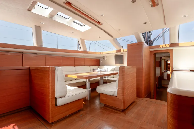 Caiarossa Yacht Photos Pics Luxurious interior of 2009 Shipman 72 yacht with elegant wood finish and spacious seating area.