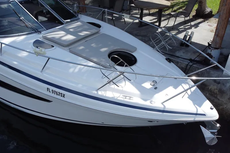 Panacea Yacht Photos Pics 2015 Regal 32 Express boat docked, featuring sleek design and spacious deck.