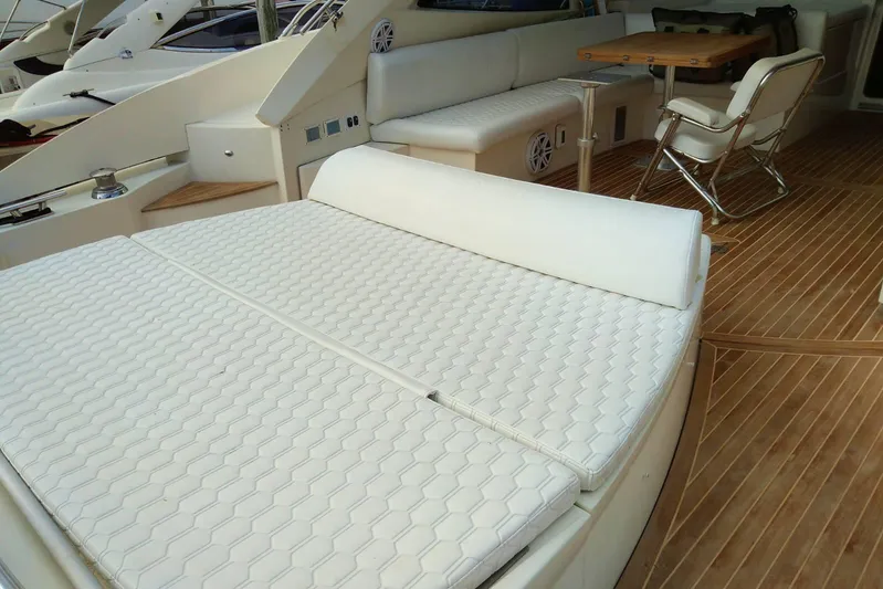 Sol Yacht Photos Pics Azimut Atlantis 54 2010 yacht interior with white seating and wooden flooring.