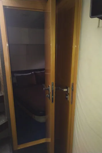 Sol Yacht Photos Pics Interior cabin view of 2010 Azimut Atlantis 54 yacht with wooden door.