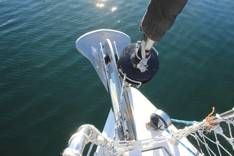 Selkie Yacht Photos Pics Bow of 2015 Jeanneau Sun Odyssey 349 sailboat with anchor and rigging.