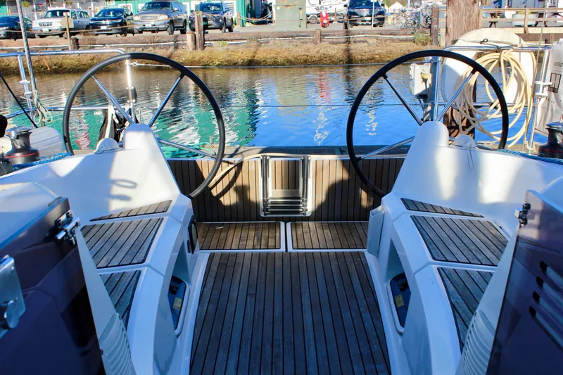 Selkie Yacht Photos Pics Cockpit of 2015 Jeanneau Sun Odyssey 349 sailboat with dual steering wheels.