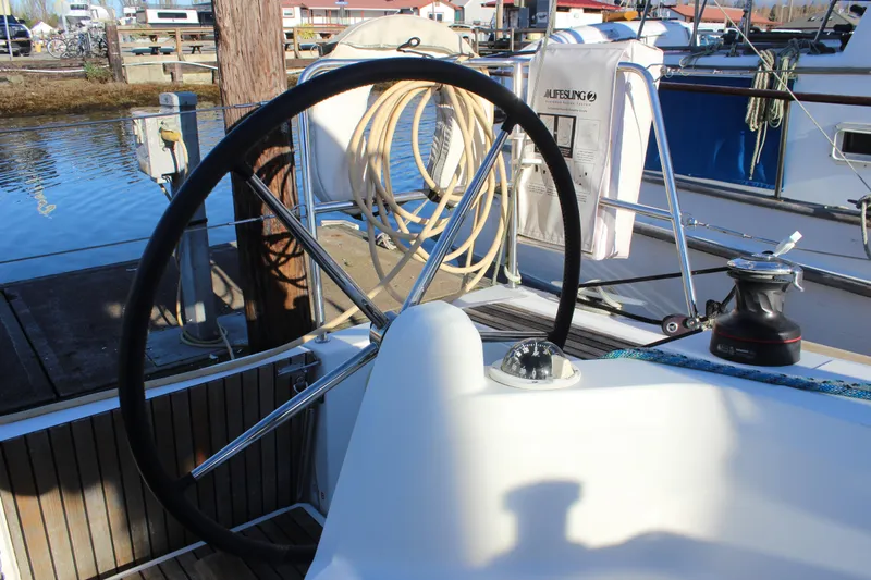 Selkie Yacht Photos Pics 2015 Jeanneau Sun Odyssey 349 sailboat cockpit with steering wheel and winch.