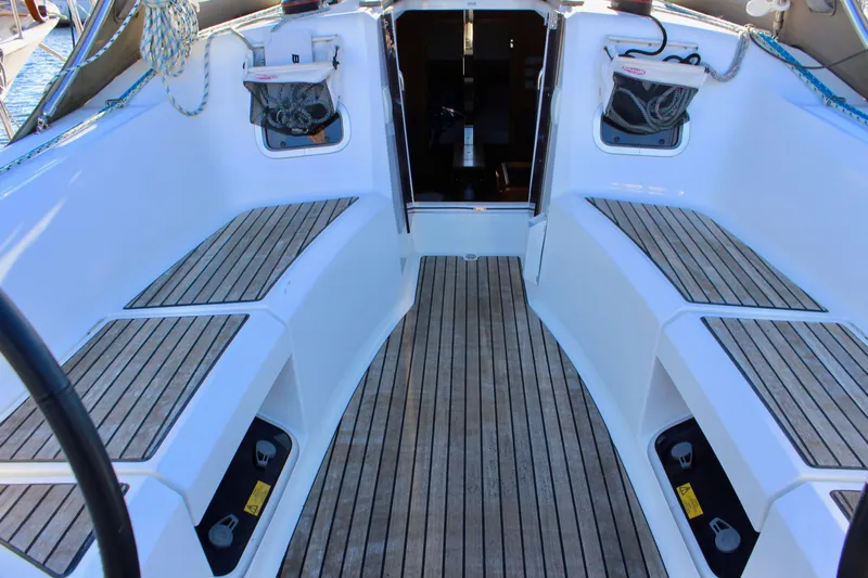 Selkie Yacht Photos Pics 2015 Jeanneau Sun Odyssey 349 yacht cockpit with teak flooring and seating.