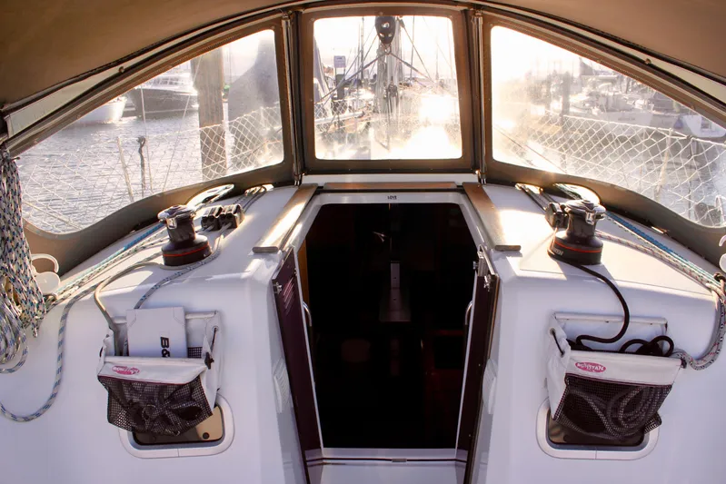 Selkie Yacht Photos Pics Cockpit view of 2015 Jeanneau Sun Odyssey 349 sailboat, featuring winches and nautical equipment.