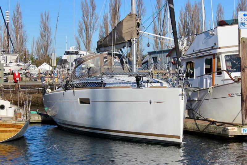 Selkie Yacht Photos Pics 2015 Jeanneau Sun Odyssey 349 sailboat docked at a marina.