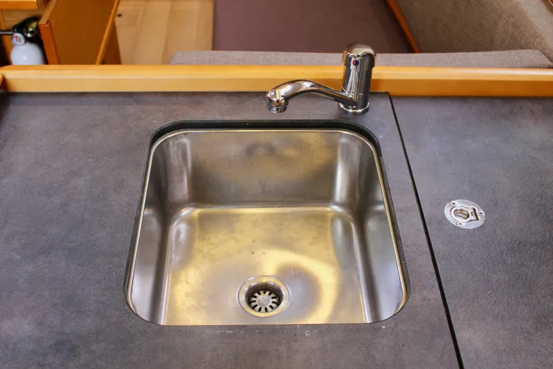 Selkie Yacht Photos Pics Stainless steel sink in 2015 Jeanneau Sun Odyssey 349 yacht kitchen.