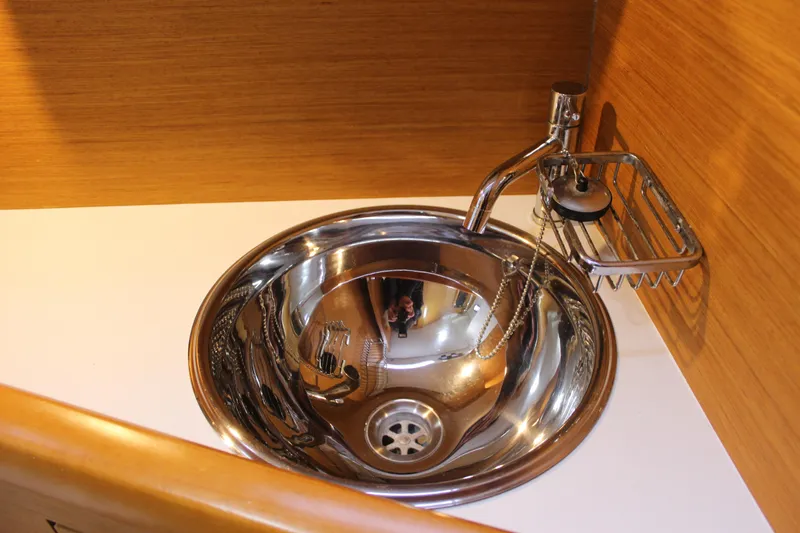 Selkie Yacht Photos Pics Stainless steel sink in 2015 Jeanneau Sun Odyssey 349 yacht interior.