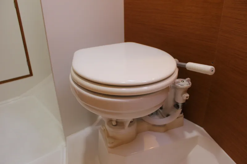 Selkie Yacht Photos Pics Marine toilet in 2015 Jeanneau Sun Odyssey 349 sailboat bathroom.