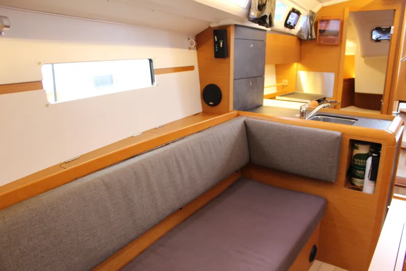 Selkie Yacht Photos Pics Interior of 2015 Jeanneau Sun Odyssey 349 sailboat with cozy seating and modern kitchen.