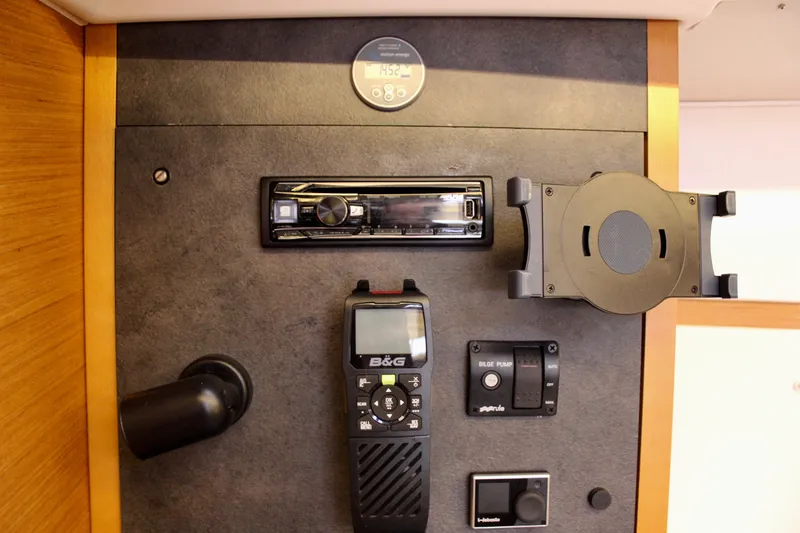 Selkie Yacht Photos Pics Control panel of 2015 Jeanneau Sun Odyssey 349 yacht with navigation and communication equipment.
