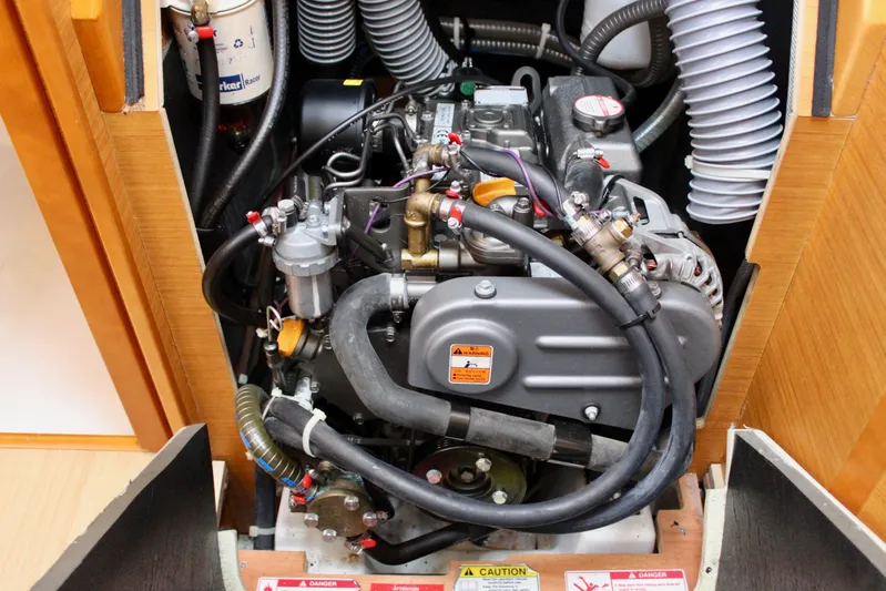 Selkie Yacht Photos Pics Engine compartment of 2015 Jeanneau Sun Odyssey 349 sailboat, showcasing detailed mechanical components.