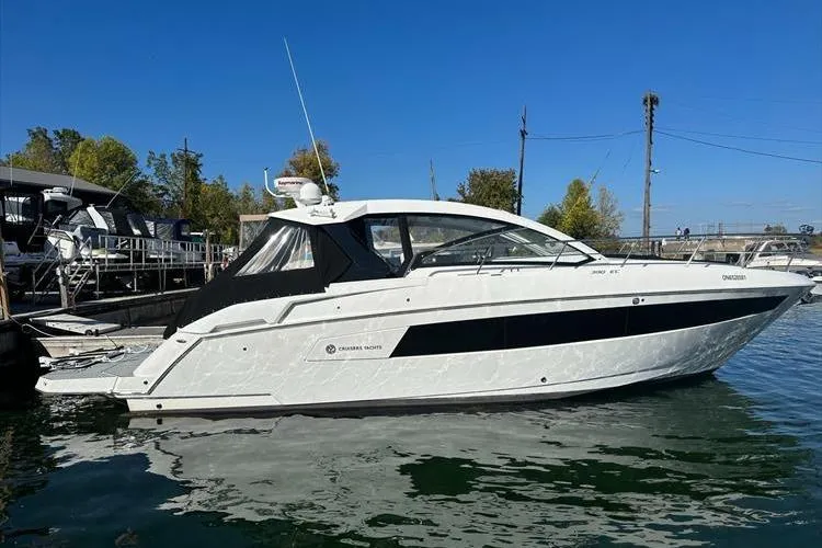  Yacht Photos Pics 2019 Cruisers Yachts 390 Express Coupe docked on calm water.