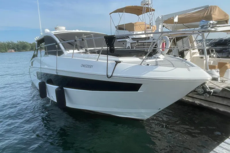  Yacht Photos Pics 2019 Cruisers Yachts 390 Express Coupe docked on a sunny day.