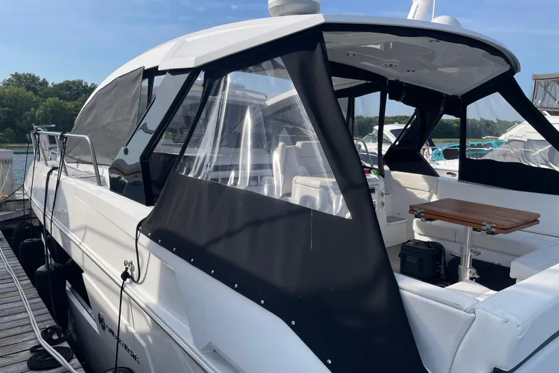  Yacht Photos Pics 2019 Cruisers Yachts 390 Express Coupe docked, featuring sleek design and spacious seating area.