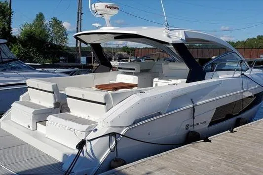  Yacht Photos Pics 2019 Cruisers Yachts 390 Express Coupe docked, showcasing sleek design and spacious seating.