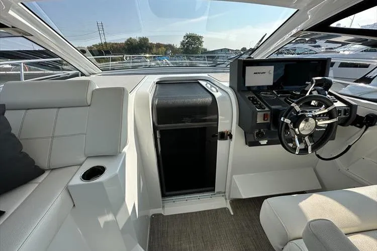  Yacht Photos Pics 2019 Cruisers Yachts 390 Express Coupe helm with modern controls and seating.