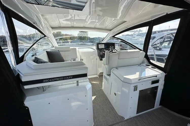  Yacht Photos Pics 2019 Cruisers Yachts 390 Express Coupe interior with modern helm and seating area.
