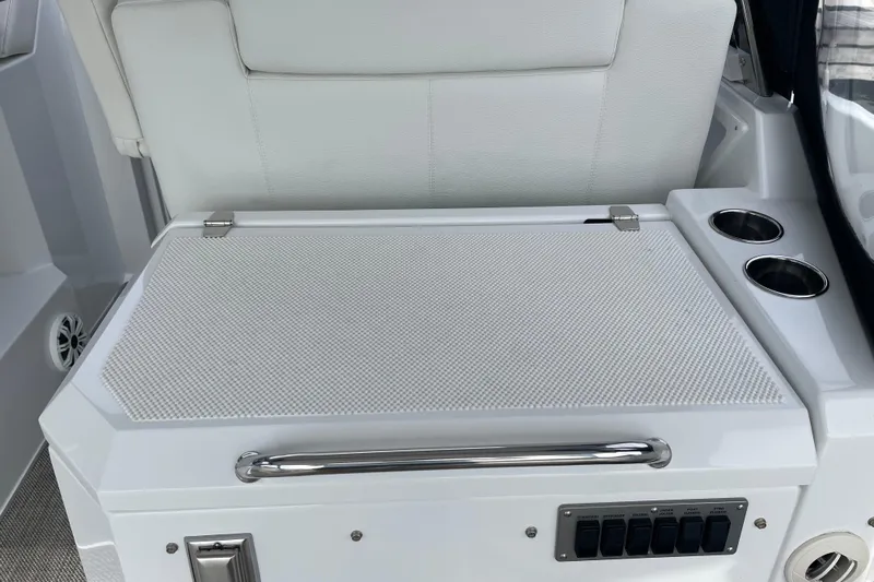  Yacht Photos Pics 2019 Cruisers Yachts 390 Express Coupe interior with seating and control panel.