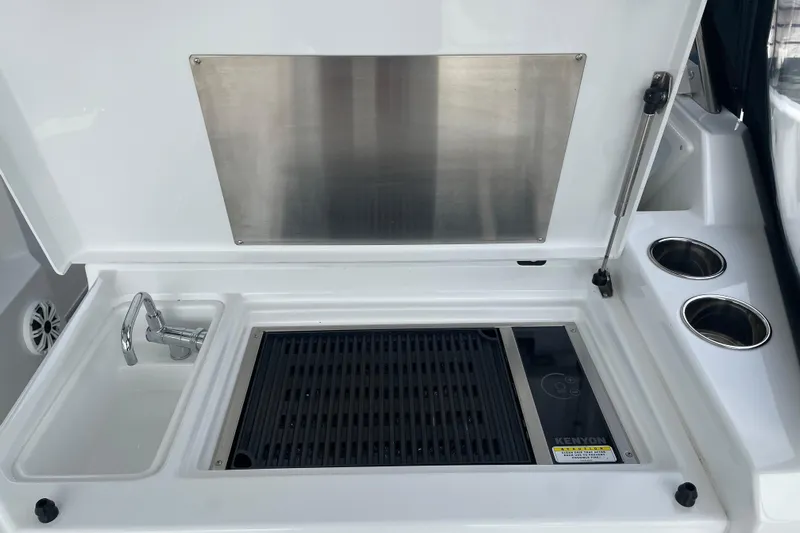  Yacht Photos Pics 2019 Cruisers Yachts 390 Express Coupe outdoor kitchen with sink and grill.