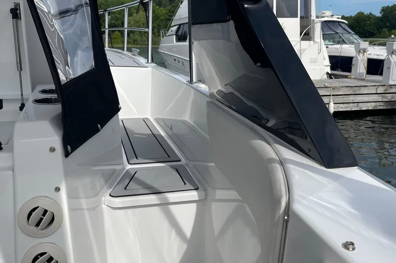  Yacht Photos Pics 2019 Cruisers Yachts 390 Express Coupe, sleek deck view at marina.
