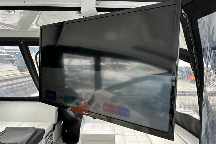  Yacht Photos Pics Flat-screen TV inside 2019 Cruisers Yachts 390 Express Coupe, showcasing modern interior amenities.