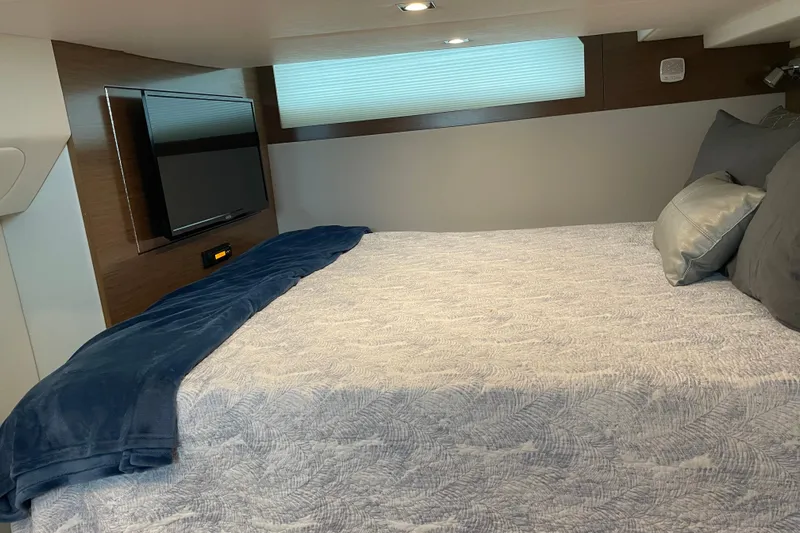  Yacht Photos Pics Interior of 2019 Cruisers Yachts 390 Express Coupe with bed and wall-mounted TV.