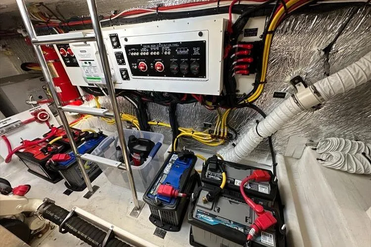  Yacht Photos Pics Engine room of 2019 Cruisers Yachts 390 Express Coupe with electrical panel and batteries.