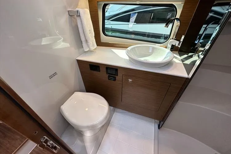  Yacht Photos Pics 2019 Cruisers Yachts 390 Express Coupe bathroom with modern sink and toilet.