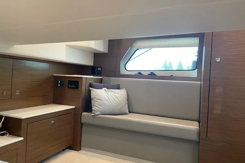 Yacht Photos Pics 2019 Cruisers Yachts 390 Express Coupe interior with modern seating and window view.